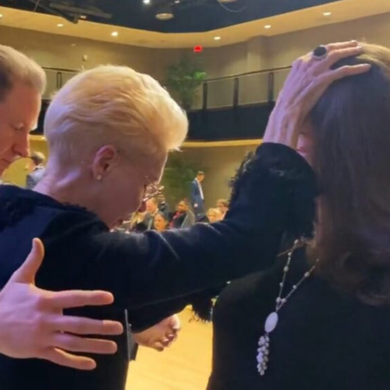 Pastor Cheryl S Jackson Laying Hands in Prayer Ministry