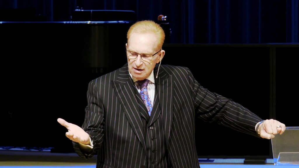 Pastor Phillip H Jackson Pinstripe Suit Cornflower Tie Contemplating